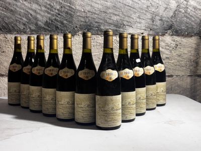 several bottles of wine are lined up in a row on a table