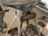 an old machine that is being worked on in a workshop
