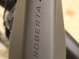 a close up of a bike with a logo on it