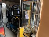 a video game machine in the middle of a room