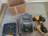 many tools that are sitting on the floor next to a box
