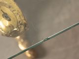 a glass table with a gold fish on top of it