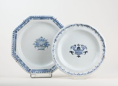 two plates with blue and white designs on them