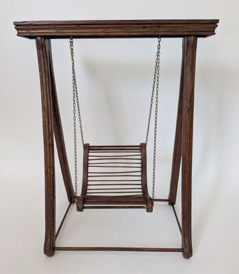 an image of a wooden swing with chains hanging from it ' s sides