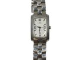 an image of a woman ' s wrist watch with a white dial