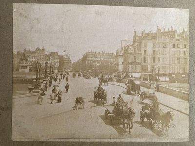 an old photo of a city street with horse drawn carriages