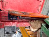 a red toolbox with a brush inside of it