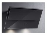 a close up of a black stove hood on a wall