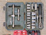 many tools that are in a case on the floor