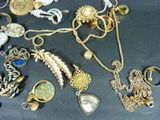 many different types of jewelry on the table