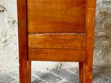 a small wooden table with a drawer on top of it