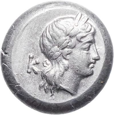 a close up of a coin with a woman ' s head on it