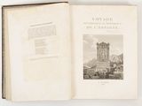 an open book with a picture of a clock tower in the background