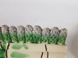 a ceramic figurine of a forest scene on a table