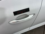 a car door handle with a sticker on it