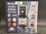 packaging of a black and silver blender sitting on top of a counter