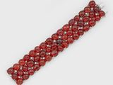 un bracelet en grenatite et diamants, signé Van Cleef