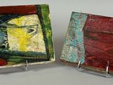 these are two pieces of art that are on display on a table