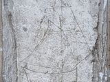 a picture of a sailboat carved into a stone wall