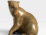 sculpture of a bear sitting on its hind legs on a white surface