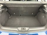 a trunk of a blue car with its doors open