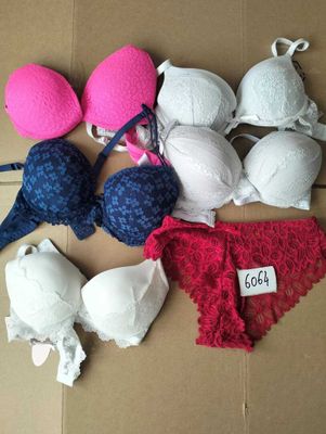 several bras and panties on a cardboard box with a price tag