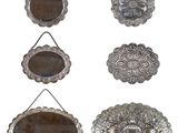 six silver plated mirrors hanging on a rope