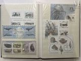 an open book with a picture of animals and fish on it