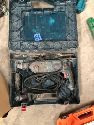 a tool box with tools on the floor next to it