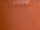 a close up of the inside of a brown leather purse
