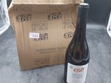 a bottle of wine sitting next to a box of wine