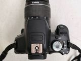 a camera with a lens attached to it ' s body