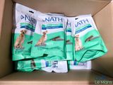 many bags of dog food sitting in a box