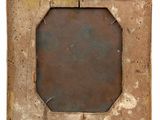 an old picture frame with a piece of paper taped to it