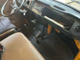 a picture of a car dashboard with a steering wheel