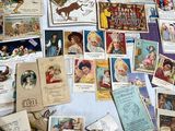 a lot of old postcards on the table