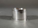 a close up of a silver ring on a table