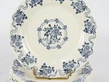 three plates with blue and white designs are stacked on top of each other