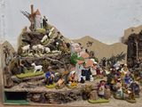 many figurines of people in a nativity setting