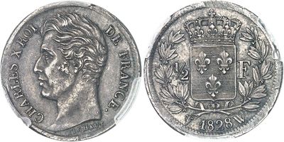 a close up of a coin with a crown on top of it