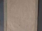 an old piece of paper with a piece of paper on top of it