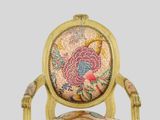 a chair that has a floral design on it