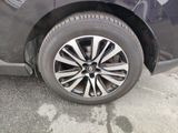 a close up of a car ' s tire on the pavement