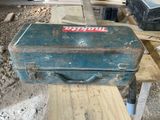 an old tool box sitting on a table in the middle of a room