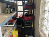 a room with shelves and a ladder in it