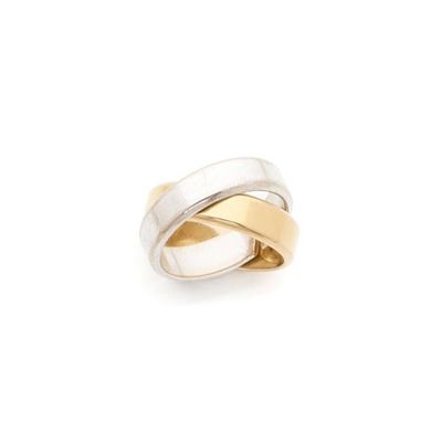 a close up of a gold and silver ring on a white background