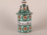 an image of a ceramic jar with the word cornichum written on it
