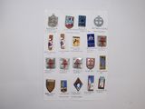 a picture of a wall with a bunch of badges on it