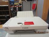 a printer sitting on top of a table in a room