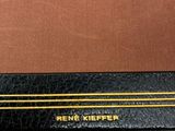 an image of a black book with a gold line on it